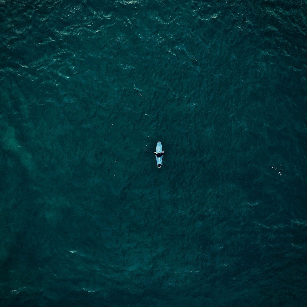 aerial view of person riding kayak boat