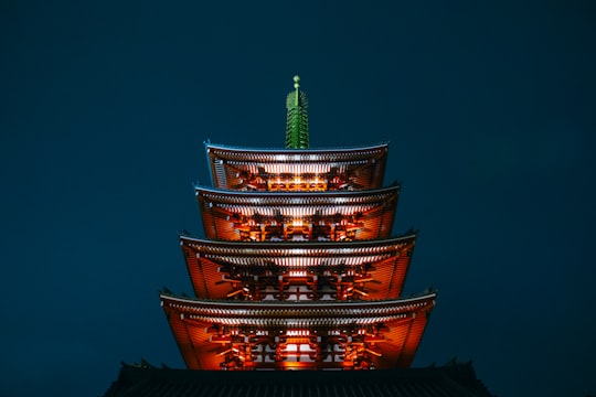photo of red pagoda during nighttime in Sensō-ji Japan