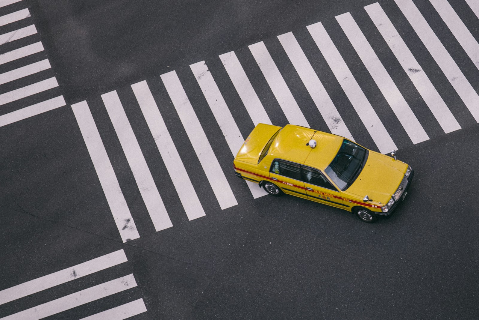 Canon EF 24-70mm F4L IS USM sample photo. Yellow taxi on gray photography