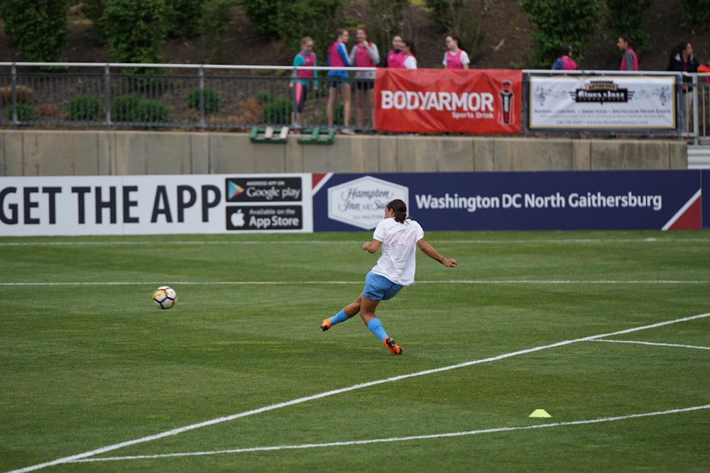 person playing soccer on field