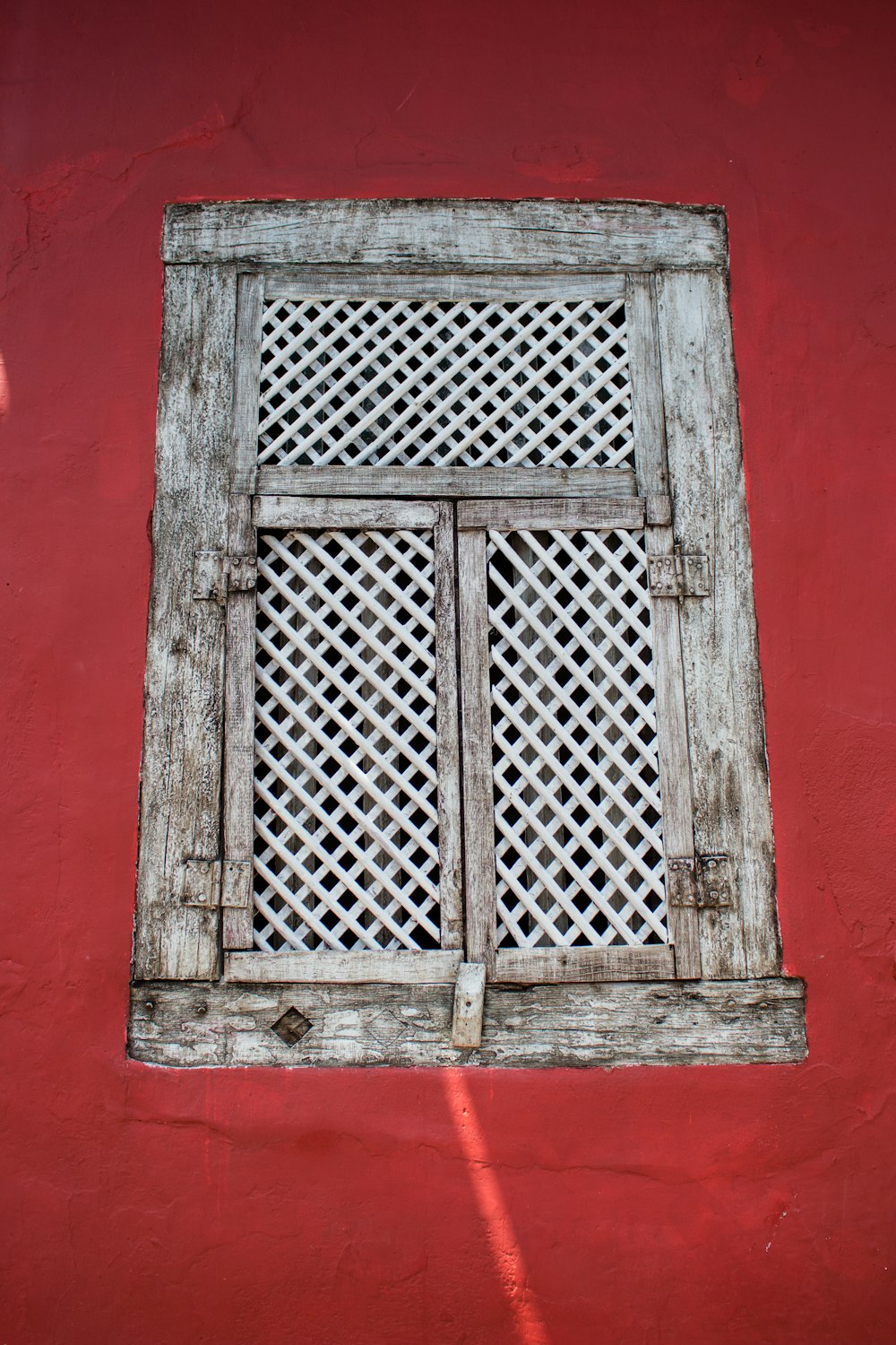 close-up photo of gray wooden door windows