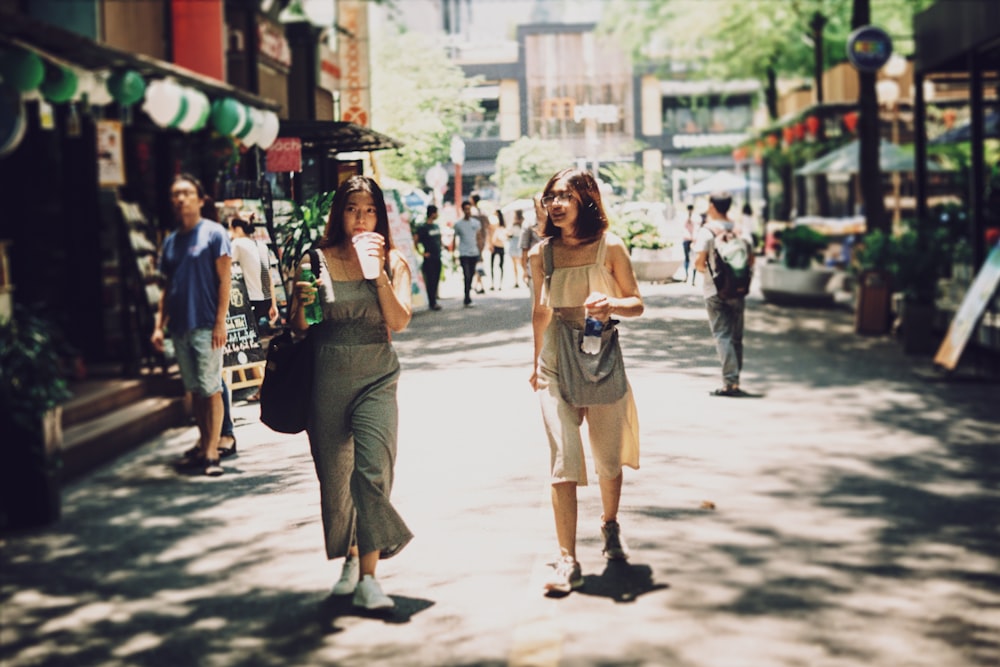 two women holding cups