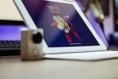 Close-up of hands setting up automation software on a tablet.