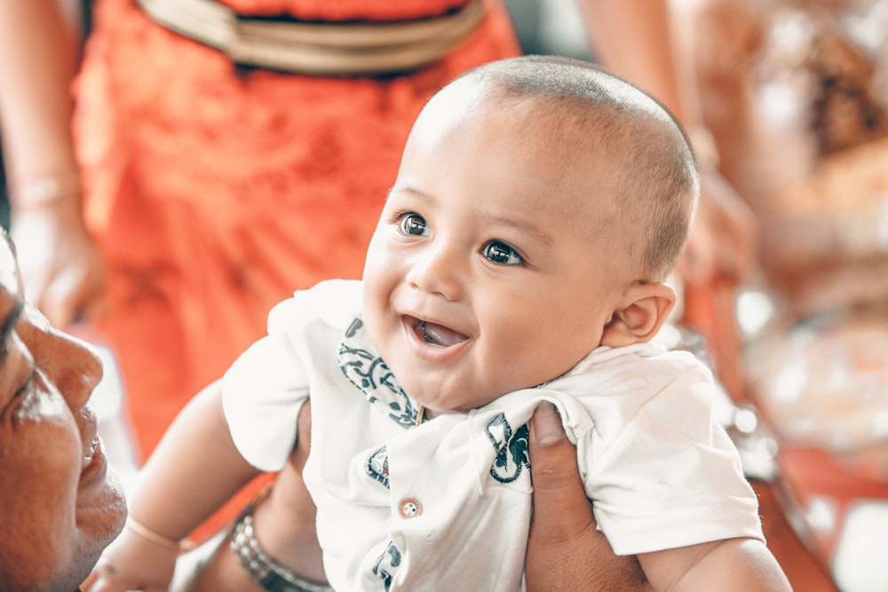 person carrying baby