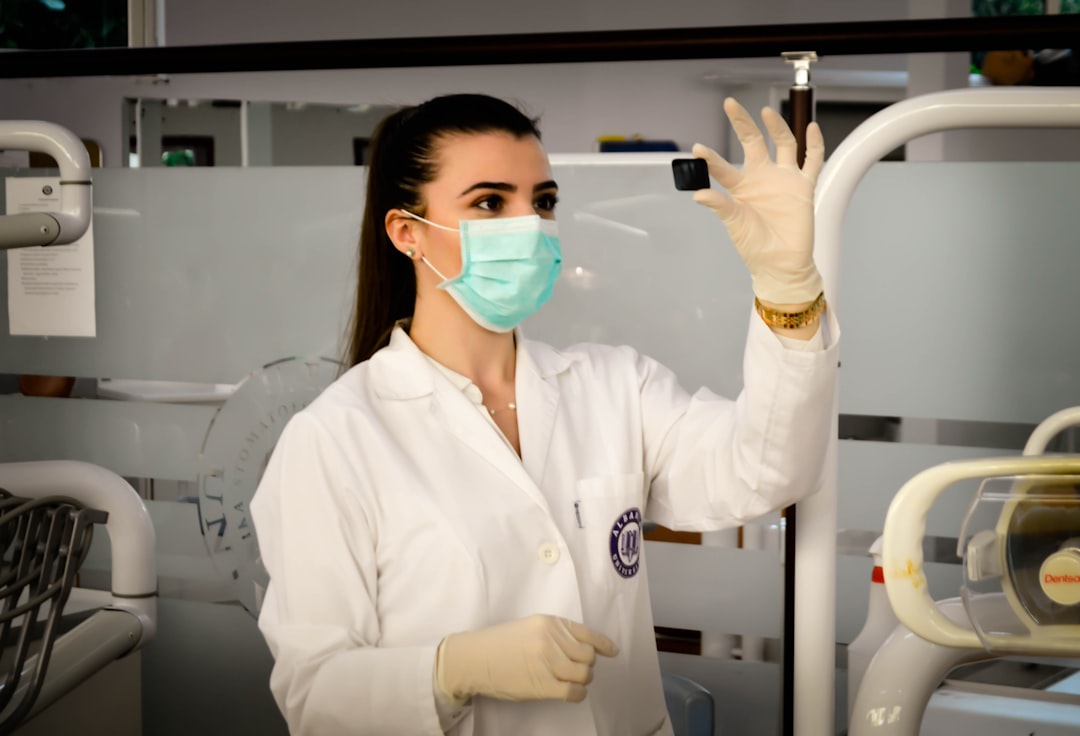 A student looks at a sample in a lab