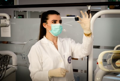 woman inside laboratory nurse google meet background