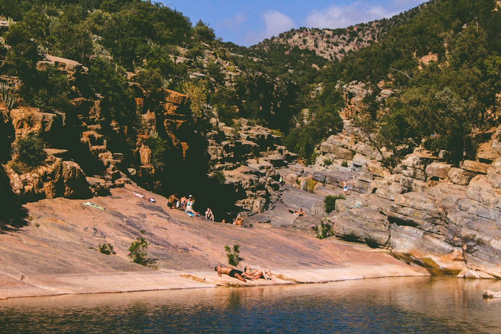 two people sleep beside river