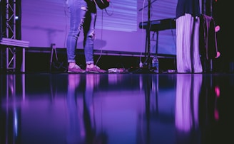 person playing guitar on stage