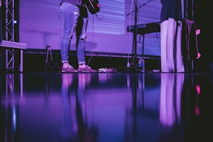 person playing guitar on stage