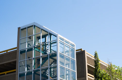 Natural smoke extraction system integrated into a modern parking structure.