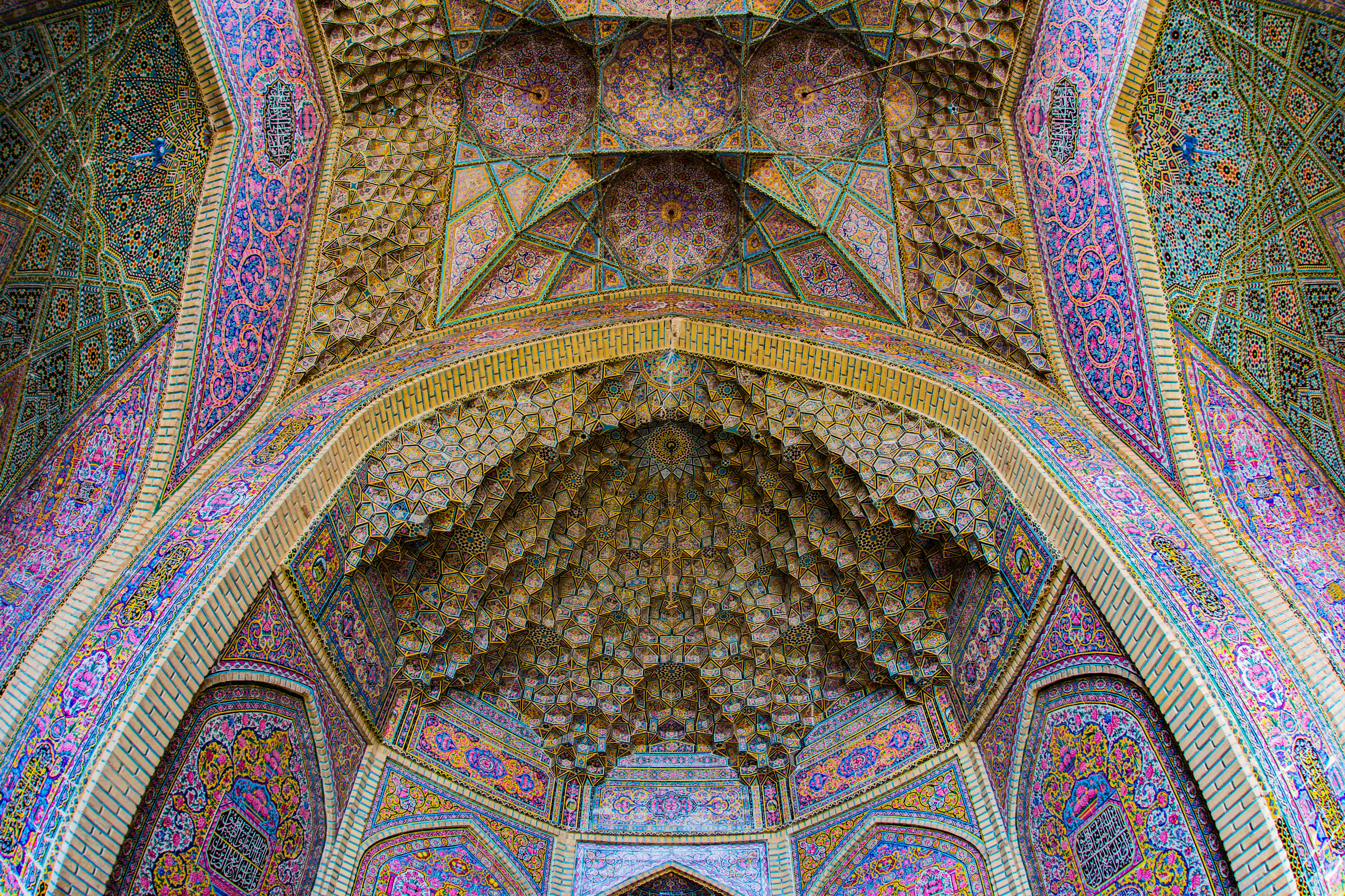 Shiraz, Iran - Nasir-al-Mulk Mosque is a famous mosque in Shiraz, the largest city in southern Iran. Lots of tourists and photographers like to take the photo of colorful glasses windows. The Iwan (front gate) here is beautiful too, I think its the most beautiful Iwan in my Iran trip. Don’t miss it