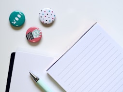 pen beside ruled paper