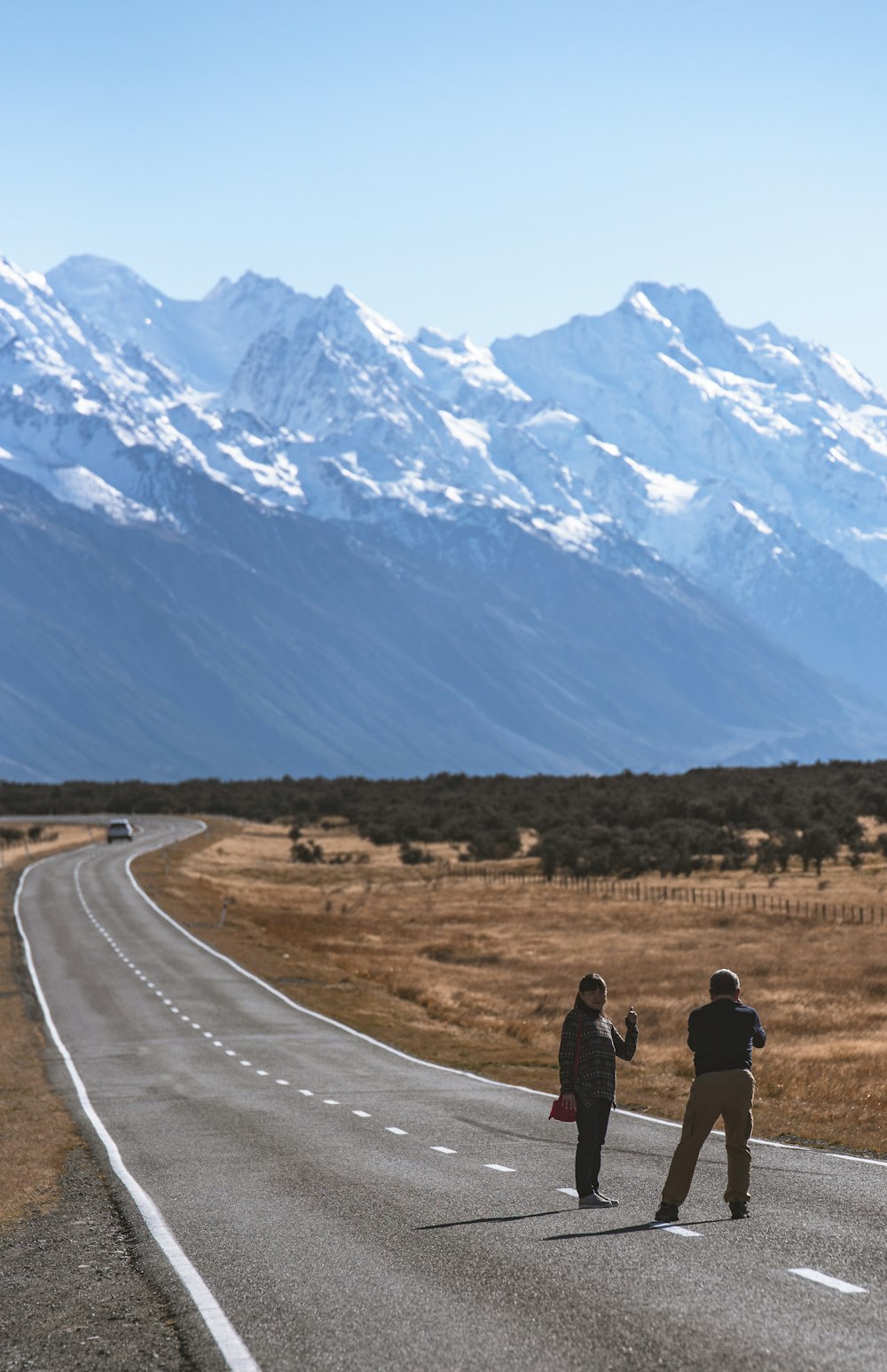 man and woman standing in the street