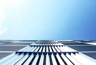 An artistic aerial perspective of a modern architectural complex, showcasing clean lines and geometric shapes.