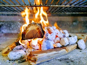 Warm, inviting scene of a barbecue gathering with glowing embers and rich textures