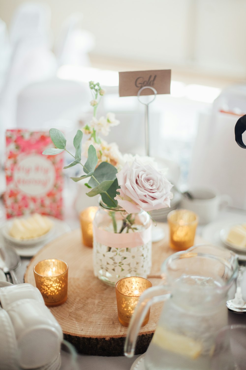 pink rose flower with glass pot centerpiece