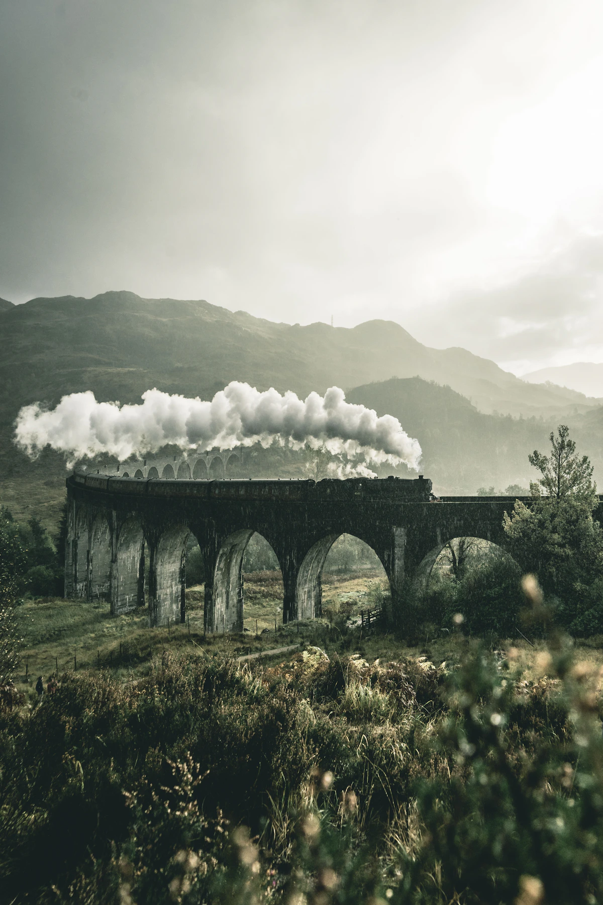European train passing through mountain scenery