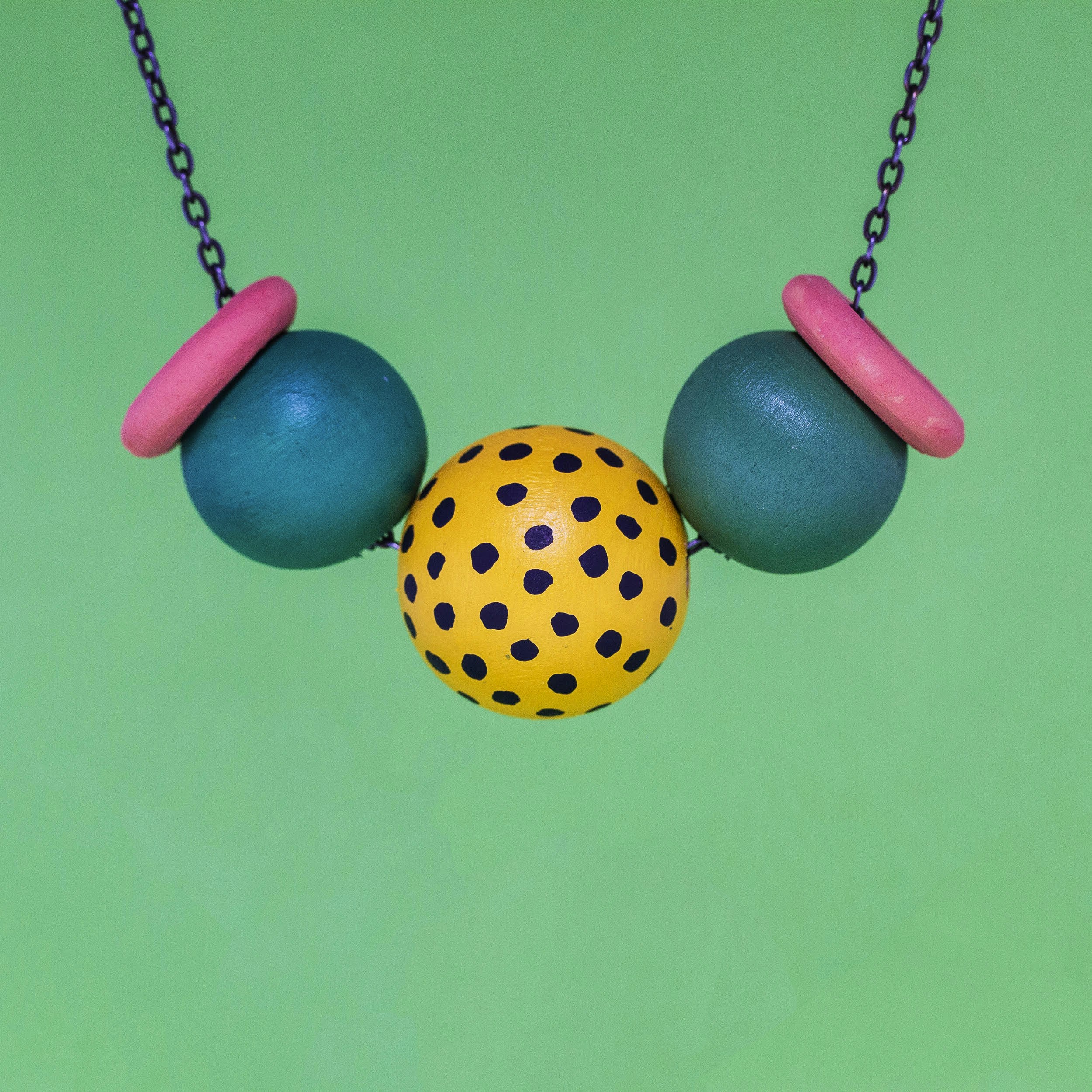 Colorful beaded waist chain jewelry on dark background