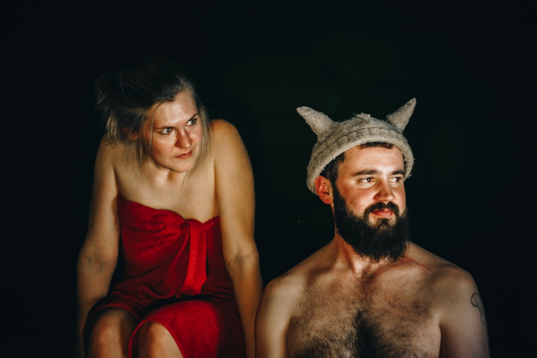 topless man near woman look at him, Anni Oviir and Adam Rang inside a traditional Estonian smoke sauna.<p></figure>www.estoniansaunas.com. This picture can be used for editorial purposes, but not commercial purposes, as it includes our faces and is recognisable as our company