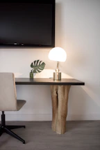 Elegant workspace with a minimalist handcrafted console table bathed in soft natural light.