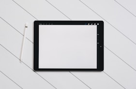 Hands working on a tablet with a straightforward digital tool interface