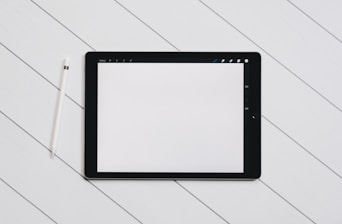 Hands working on a tablet with a straightforward digital tool interface