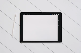 black drawing tab on white table