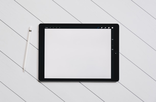 A sleek digital tablet displaying a minimalist app interface against a clean white background.