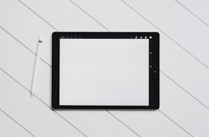 A close-up of a digital tablet displaying a UI design.