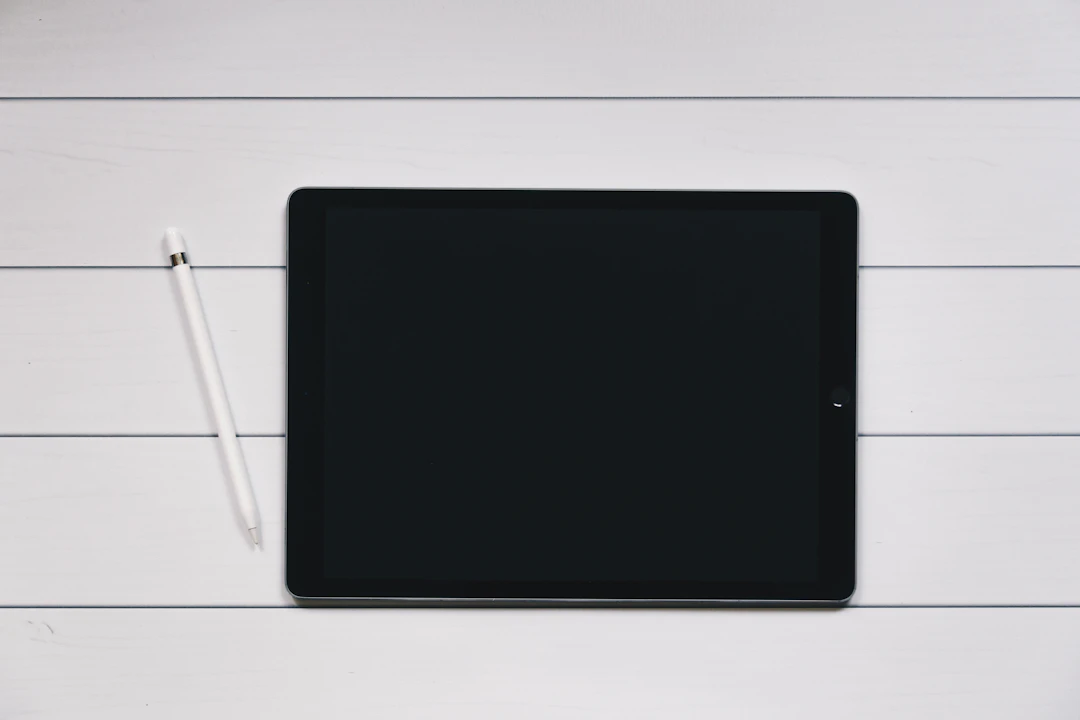 Knowledge worker experiencing burnout sitting at a desk with their head resting on folded arms
