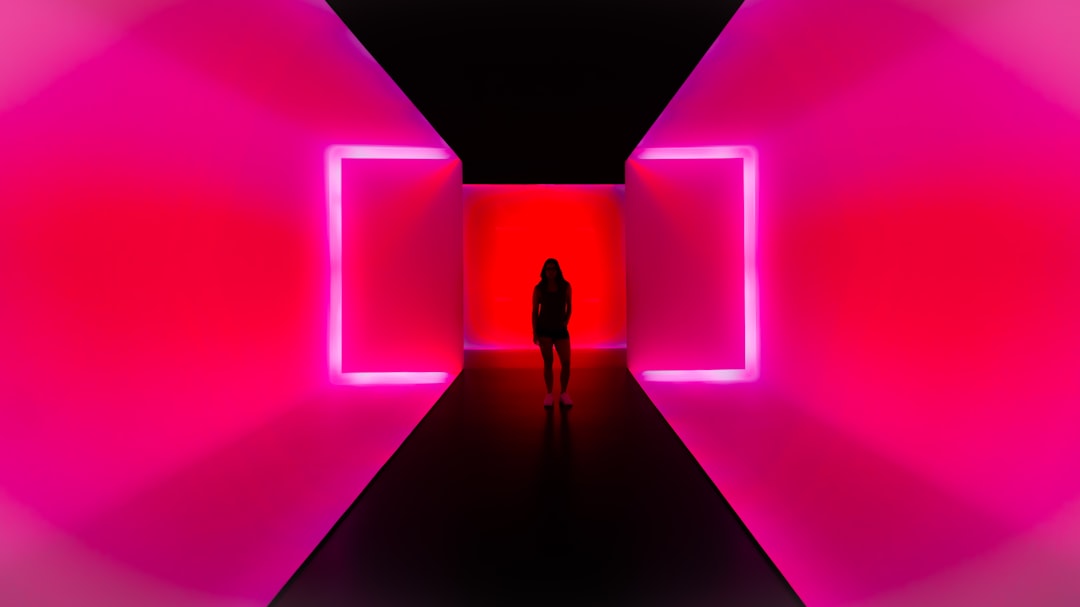 a person standing in a dark tunnel with bright lights, Some Fine Art.
