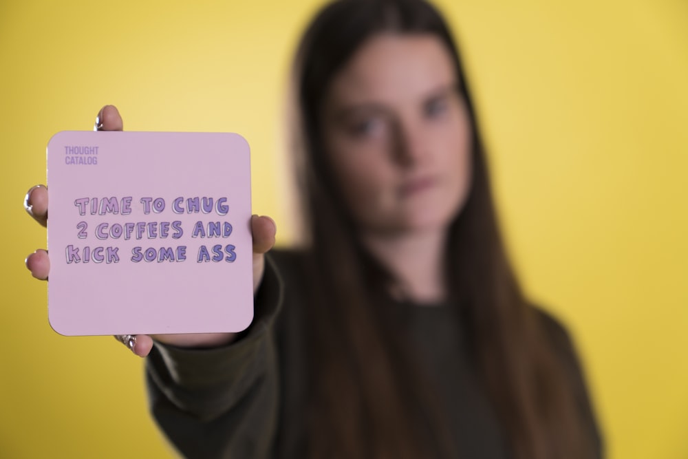 woman holding purple card