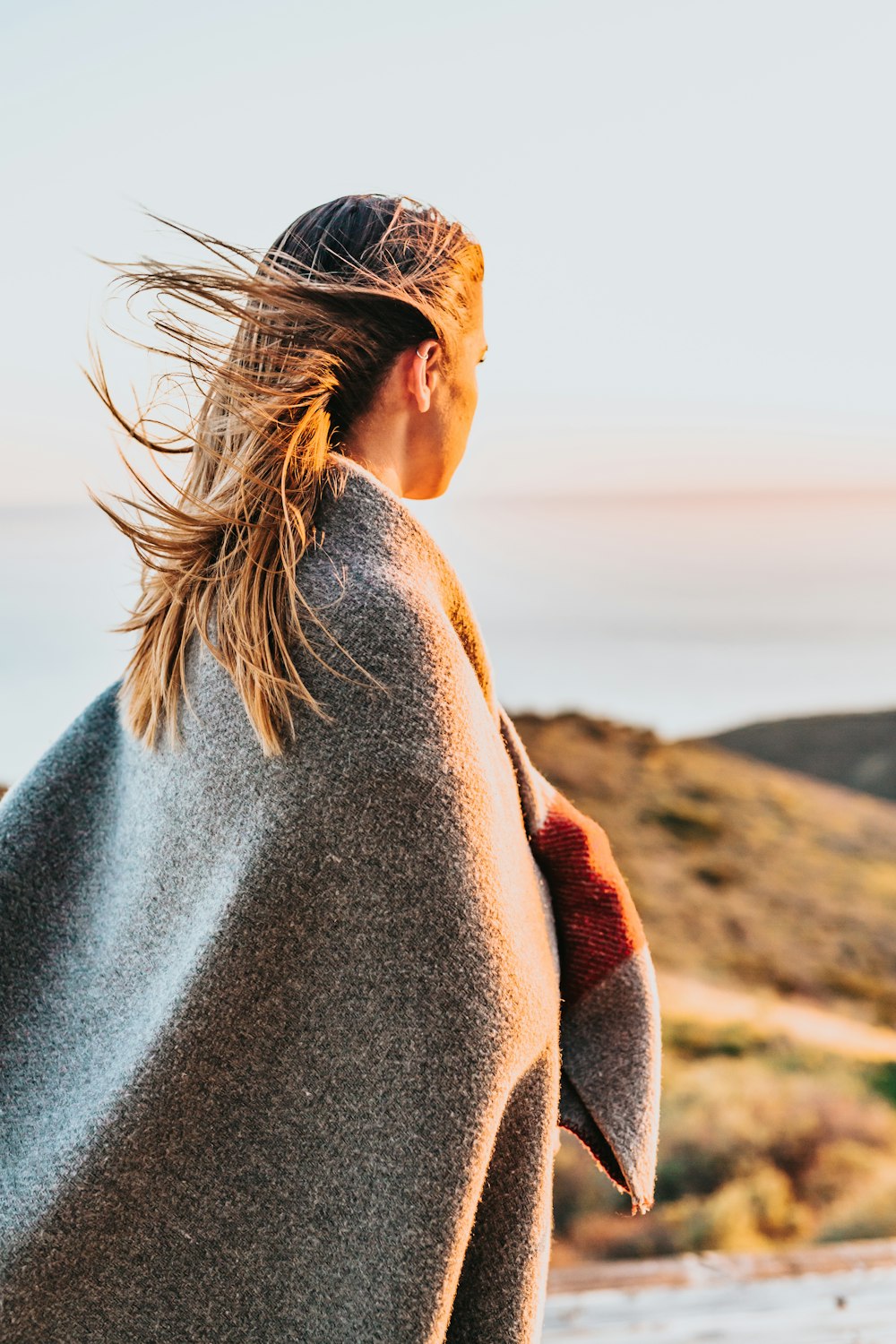 woman standing near sea shore