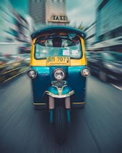 teal and yellow auto rickshaw