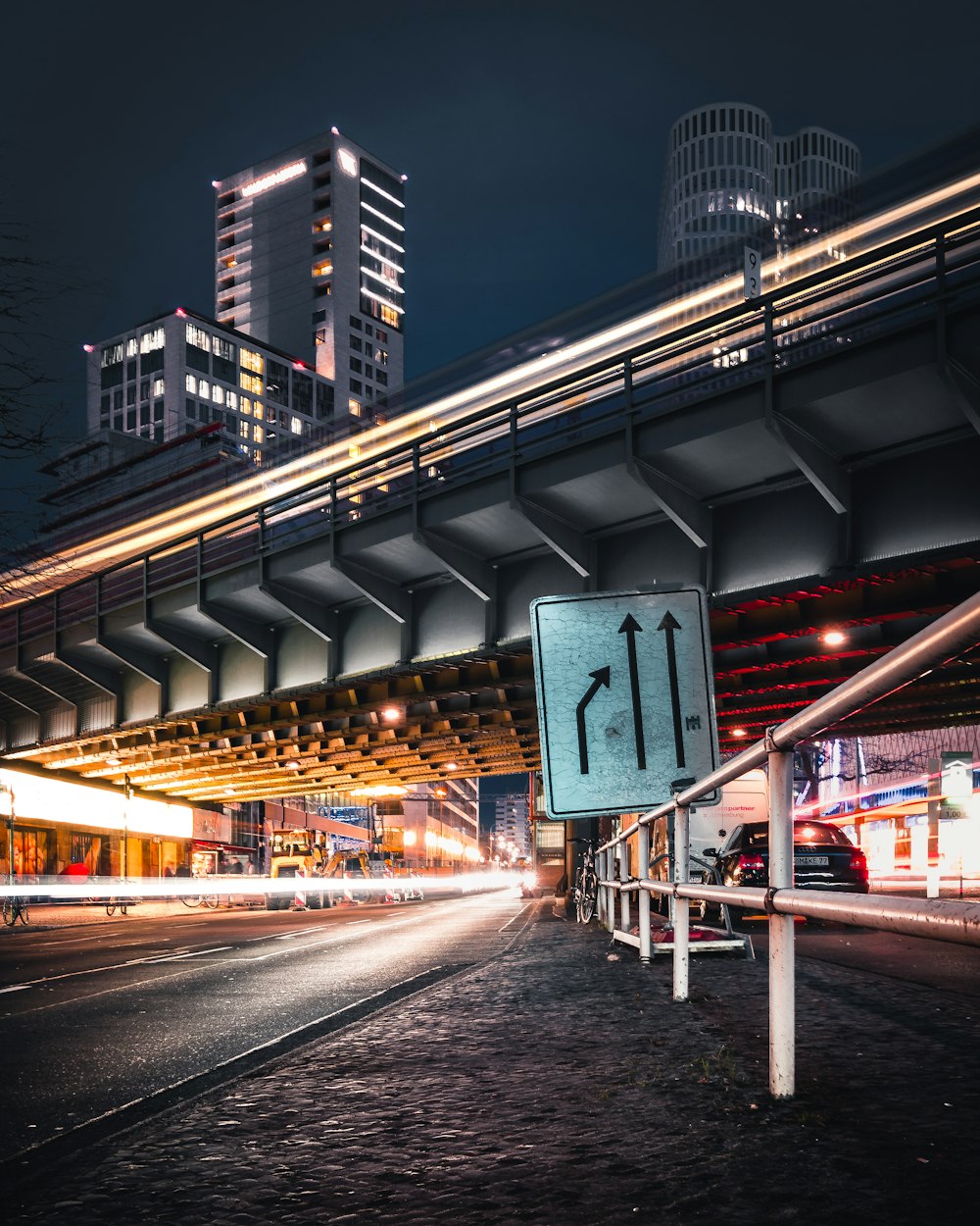 time lapse photo of black concrete road at night