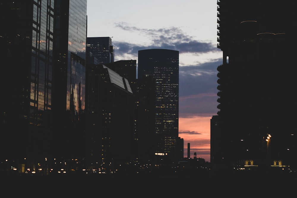 silhouette of city buildings during nighttime