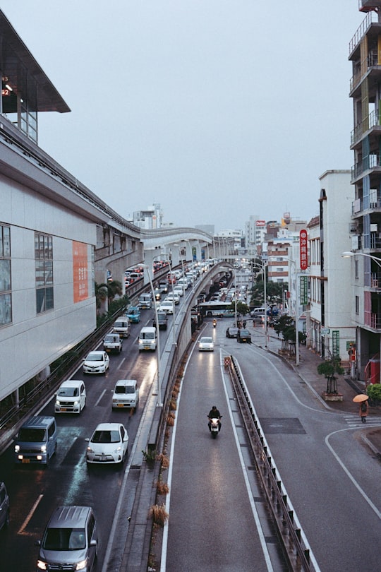 vehicles on asphalt road in Naha Japan