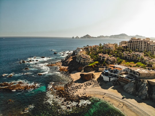 birds eye view photo of buildings and body of water in Cabo San Lucas Mexico