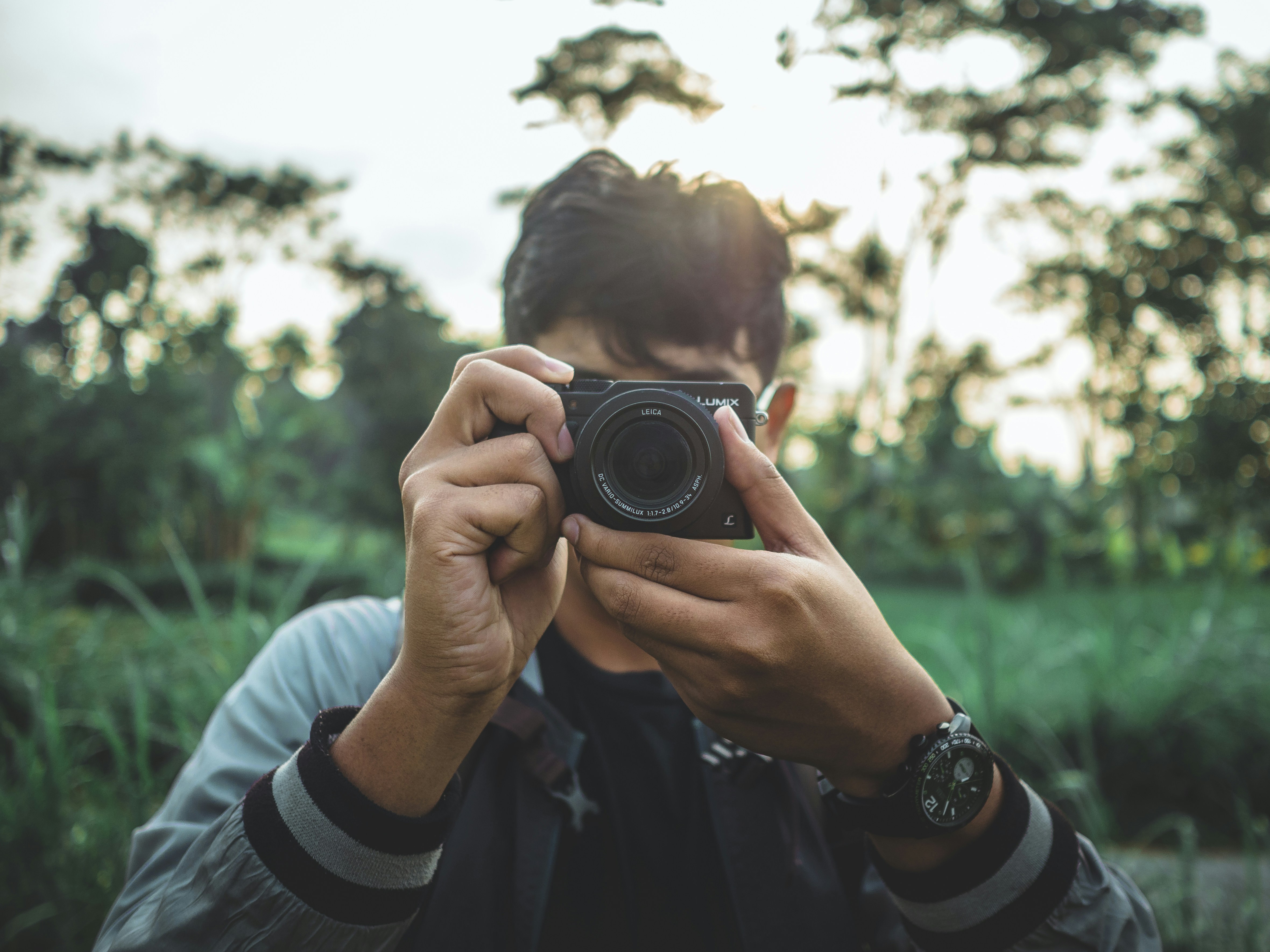 man holding a black camera