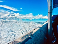 Action shot of a boat making a sharp turn, water splashing high.