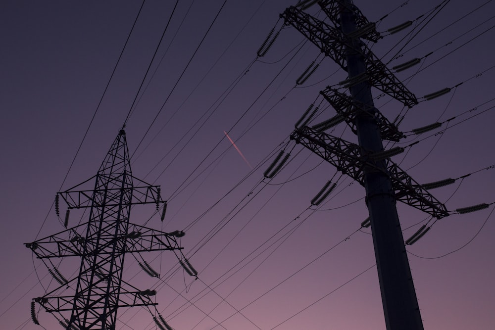 silhouette of electric towers