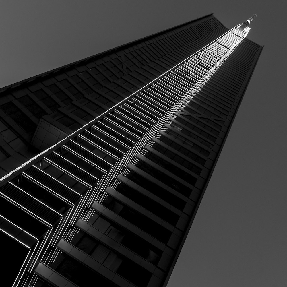 grayscale photography of concrete high-rise building
