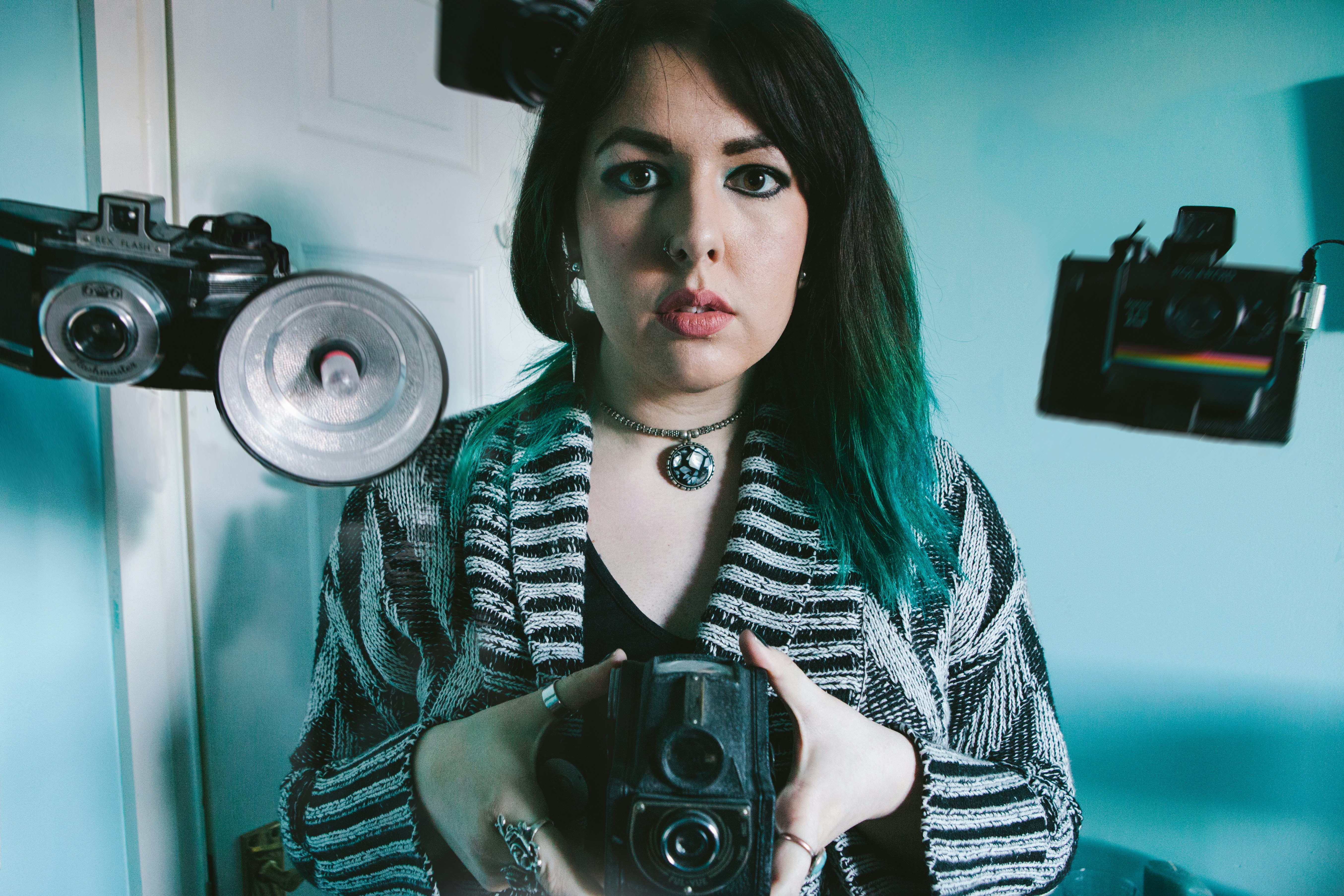 woman holding black camera