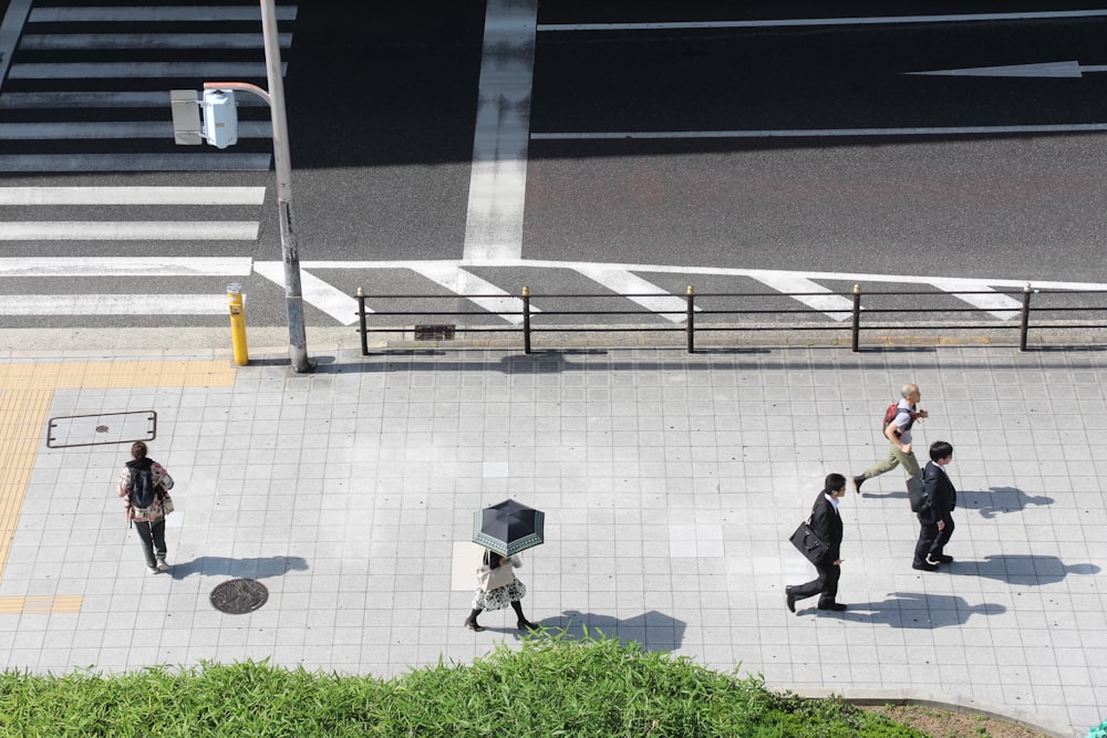 group of people walking on street walk