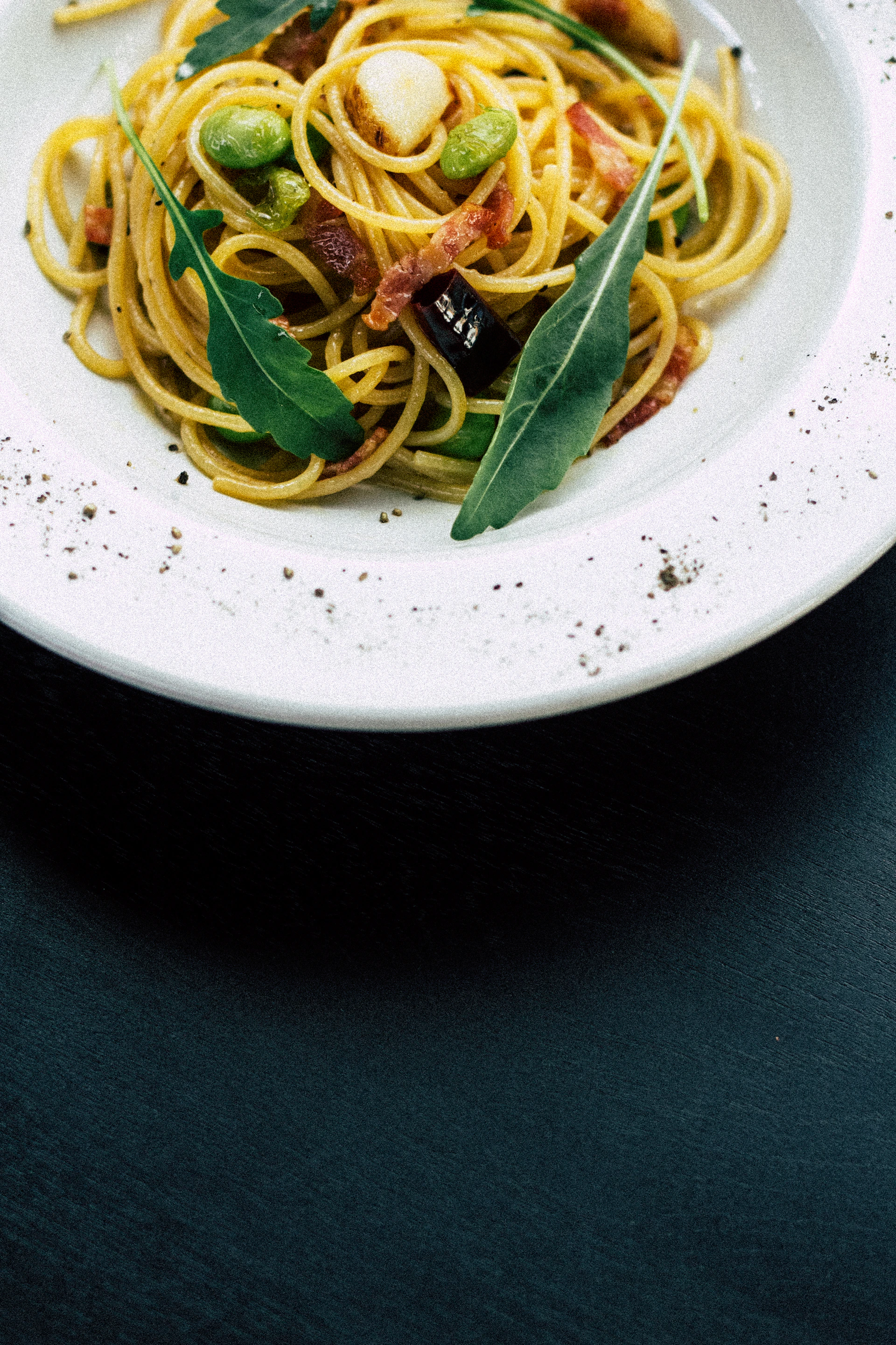 cooked noodles on white ceramic bowl