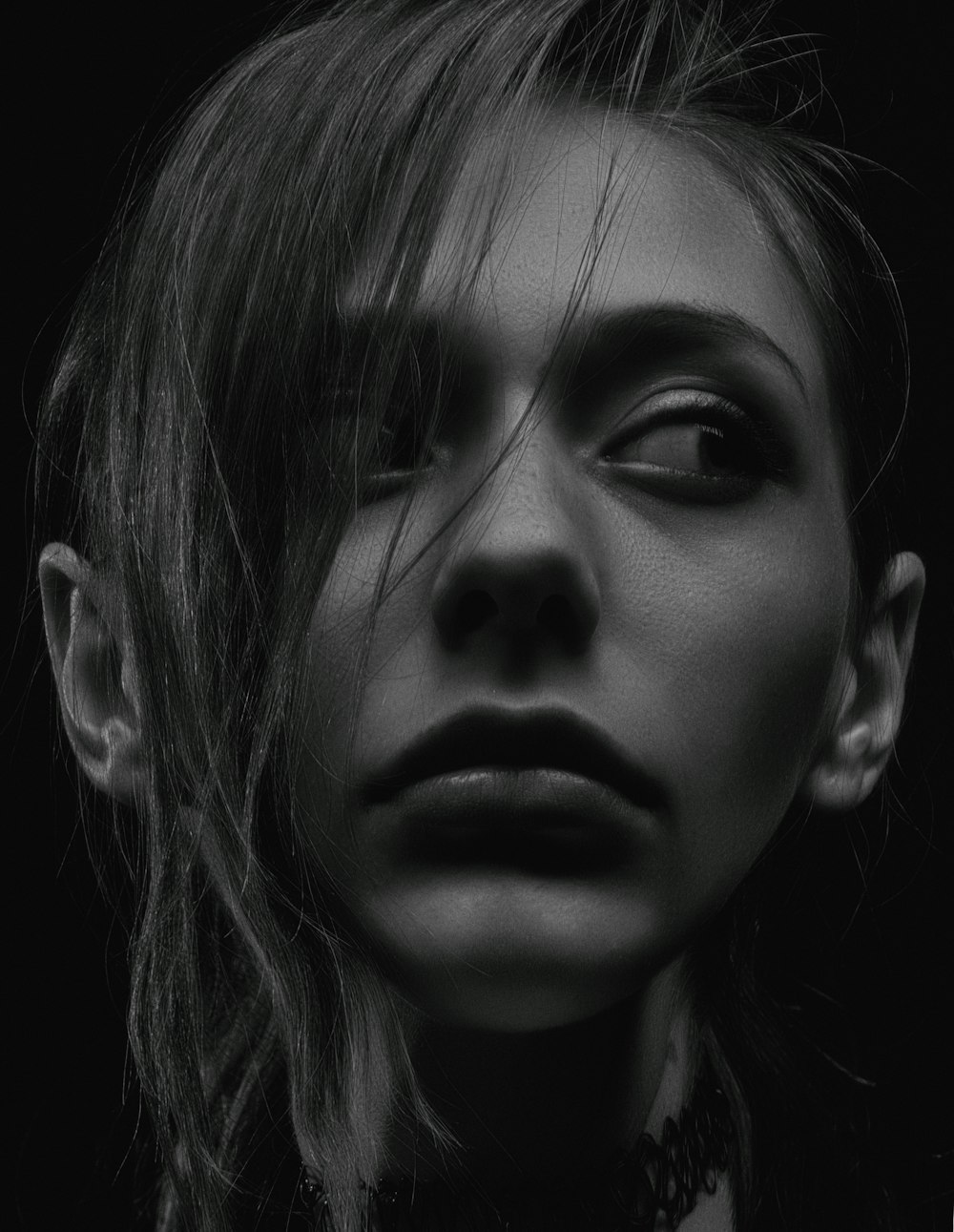 grayscale photography of woman wearing choker necklace