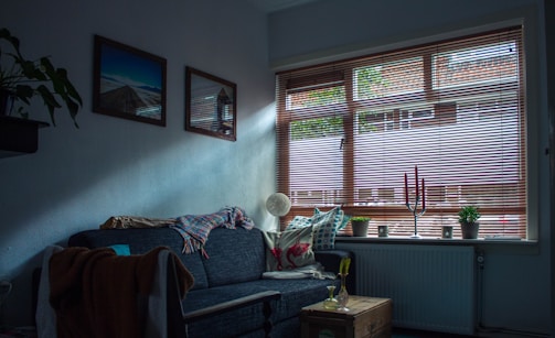 gray fabric sofa inside room