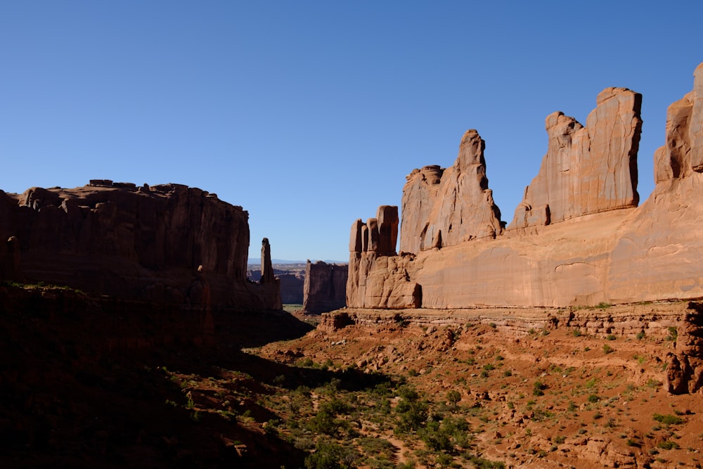 brown rock formation under blue sky