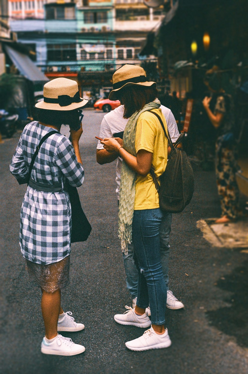 woman standing holding smartphone