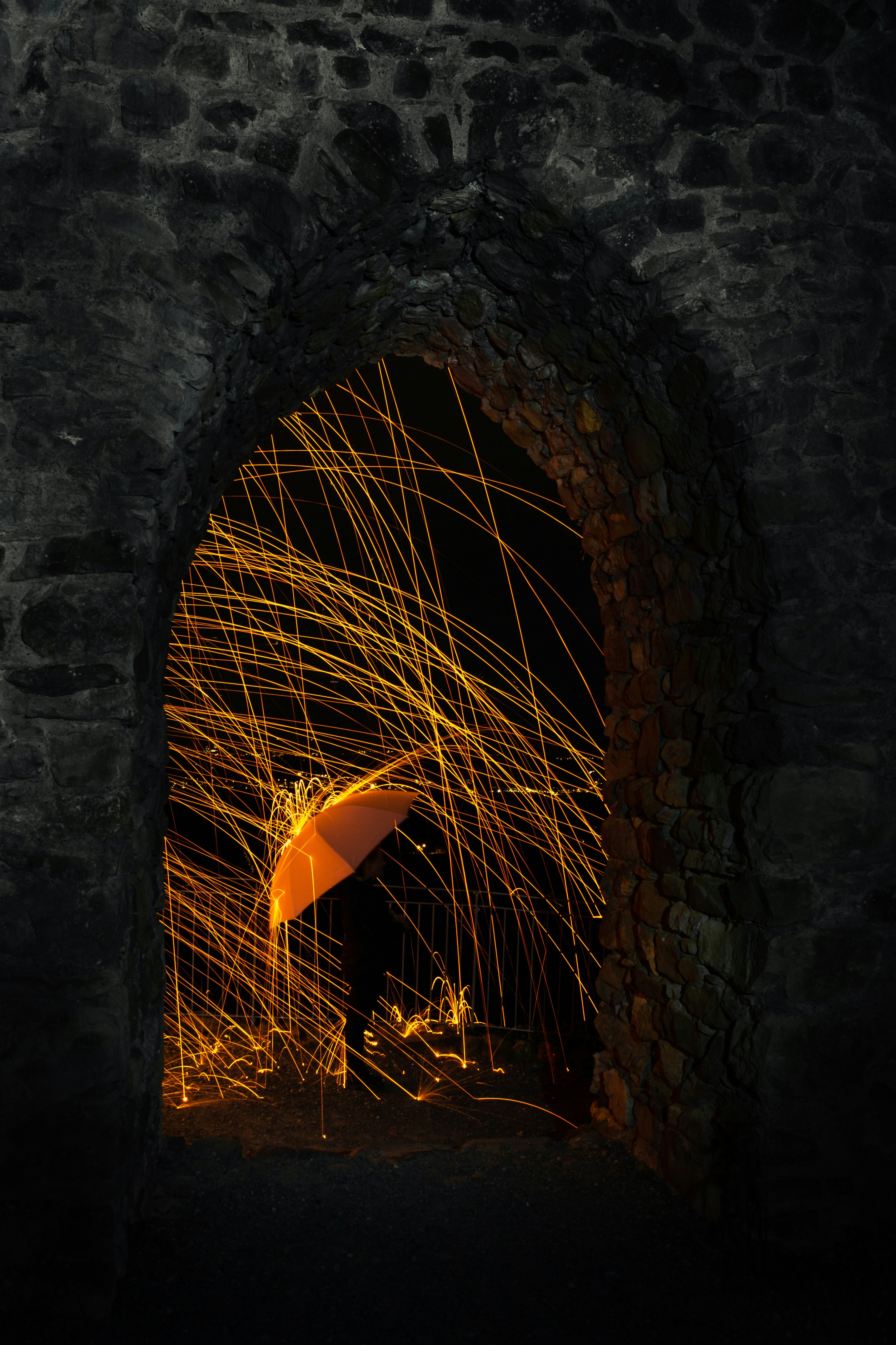 steelwool photography and orange umbrella